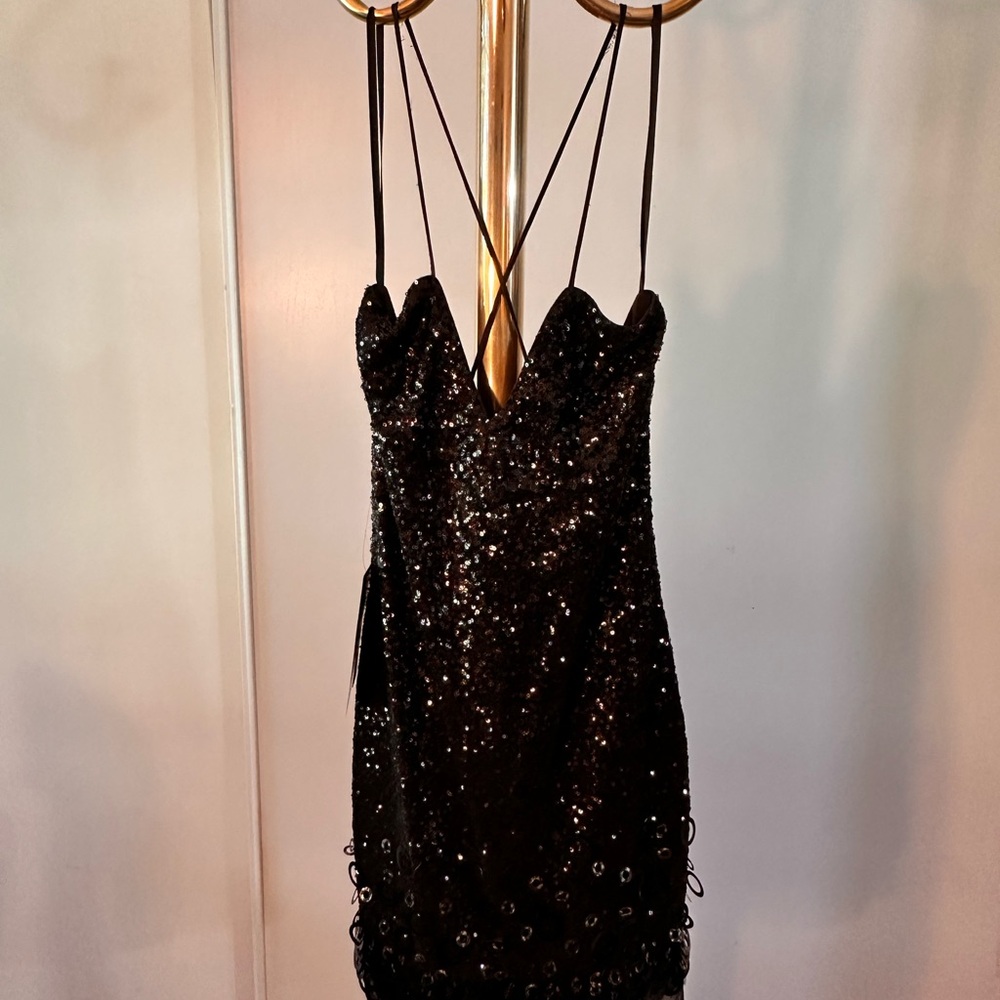 Black evening dress w/ thin strap that makes X at the back. New. High quality.